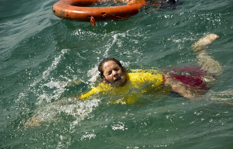 A Honduran Naval trainee performs a swimming aptitude test April 4, 2016 along the northern coast of Honduras. The test helped to establish proficiency in the water and to better develop the skills of the entire training class, during the first-ever consolidated infantry course hosted by the Honduran Navy. (U.S. Air Force photo by Capt. Christopher Mesnard)