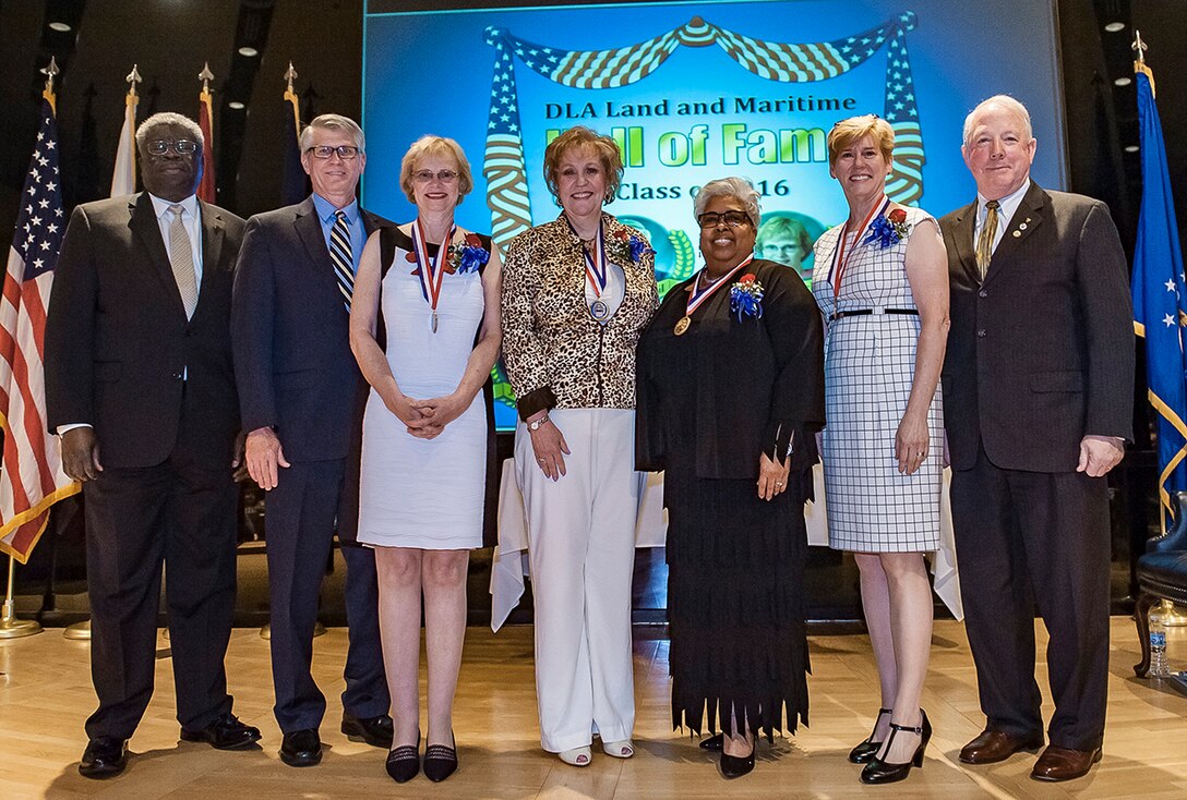 Five former Defense Logistics Agency Land and Maritime associates were inducted into the organization’s Hall of Fame May 4 at Defense Supply Center Columbus. Pictured (l-r) are Milton Lewis, Land and Maritime acquisitions executive; Ben Roberts (accepting on behalf of William Breil); Diane Circle; Joyce Collins; Vikki Hawthorne; Patricia Shields, and James McClaugherty, Land and Maritime acting commander.