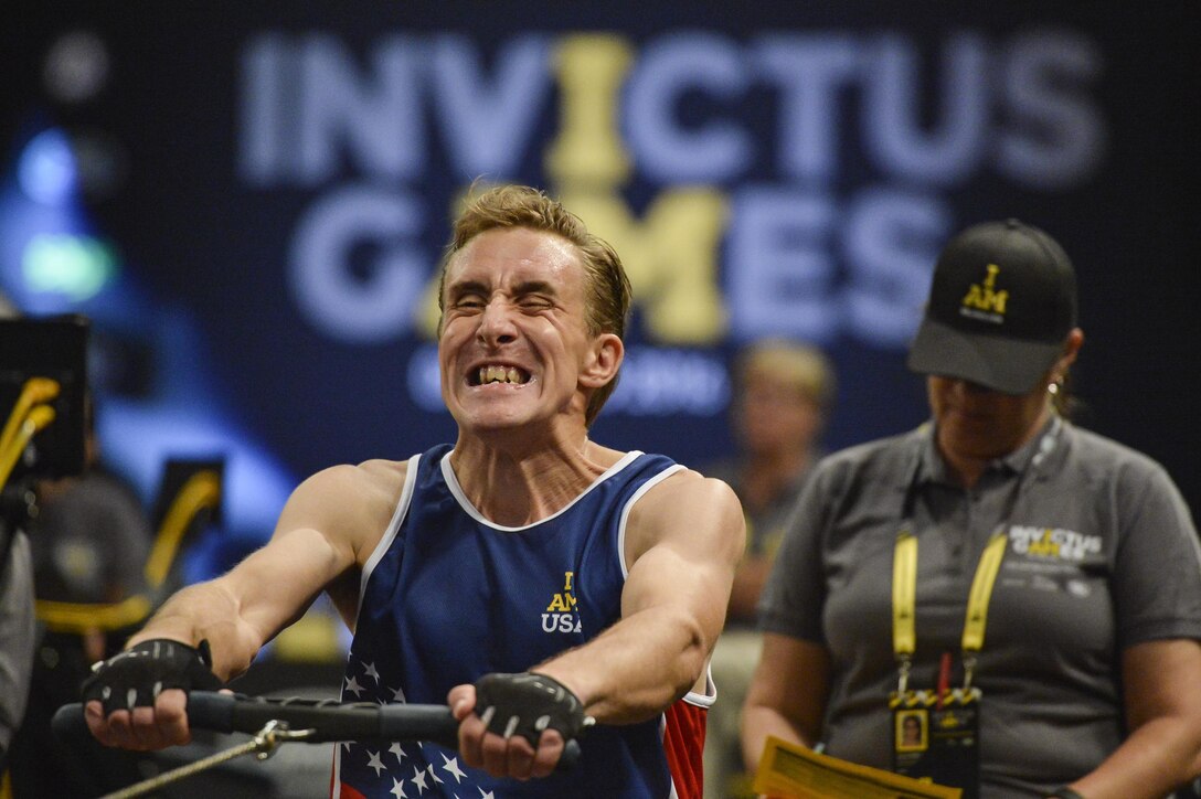 Retired Navy Petty Officer 2nd Class Stephan Miller grits his teeth as he competes in a rowing event during the 2016 Invictus Games in Orlando, Fla., May 9, 2016. Air Force photo by Tech. Sgt. Joshua L. DeMotts