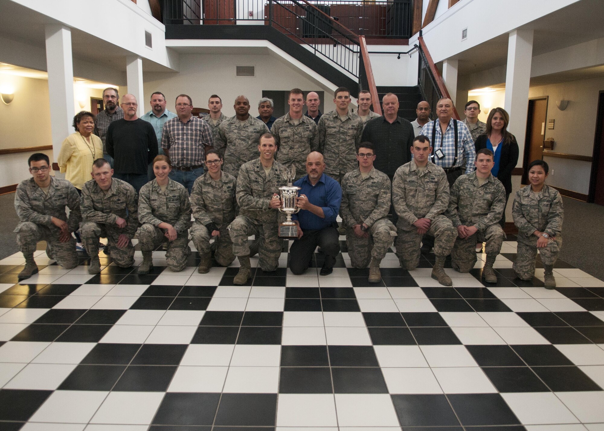 The 90th Civil Engineers Squadron pose with the 2016 Cheyenne Trophy Award, May 9, 2016, on F.E. Warren Air Force Base, Wyo. The award was presented to the squadron by Cheyenne Military Affairs Committee May 6, 2016, during the Cheyenne Chamber of Commerce Luncheon. 