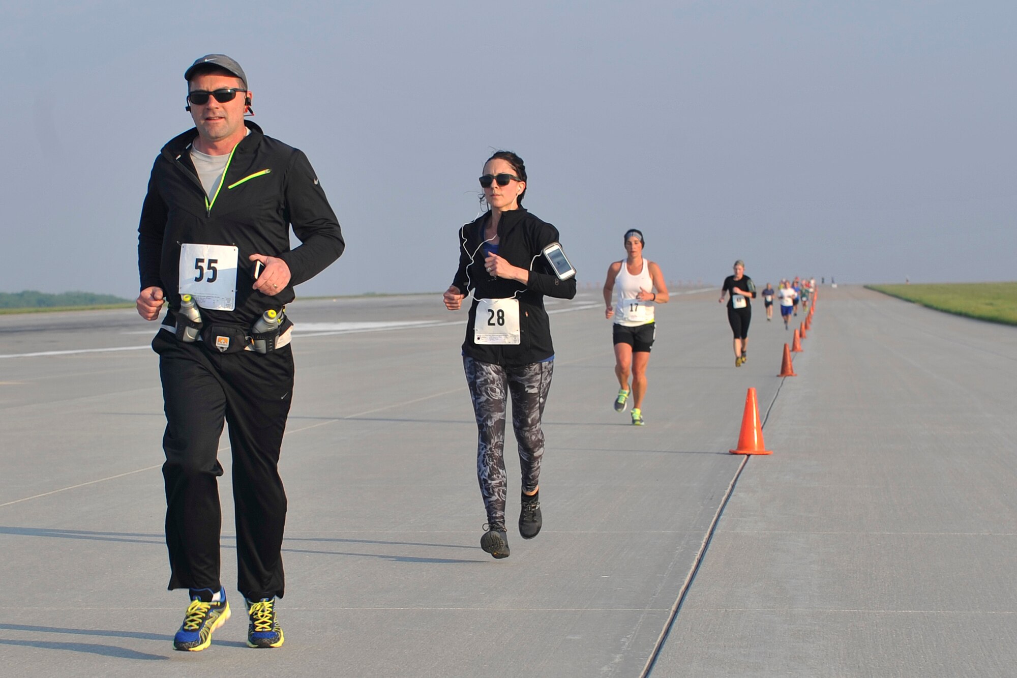 U.S. Air Force Col. Marty Reynolds, 55th Wing commander, leads a pack of runners at the eighth annual Bellevue-Offutt Runway Run at Offutt Air Force Base, Neb., May 8, 2016. More than 100 runners participated in this unique run through historic Offutt AFB. (U.S. Air Force photo by Jeff Gates
