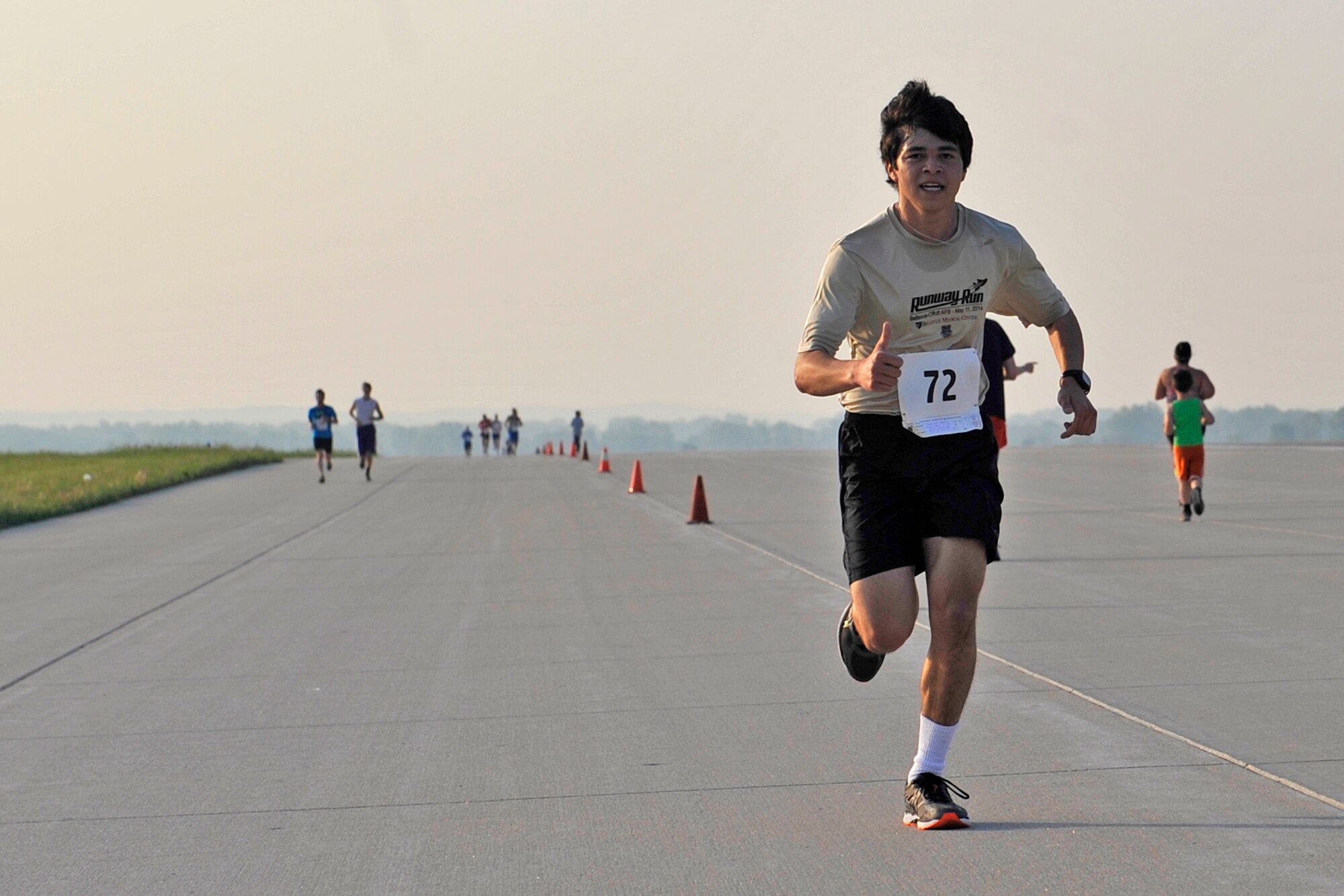 Ethan Scott from Blair, Neb., runs strong down the flightline for the eighth annual Bellevue-Offutt Runway Run at Offutt Air Force Base, Neb., May 8, 2016. Ethan placed first in the 18 and under age division. More than 100 runners participated in this unique seven-mile race from Bellevue, Neb. down the Offutt flightline and back. (U.S. Air Force photo by Jeff Gates)