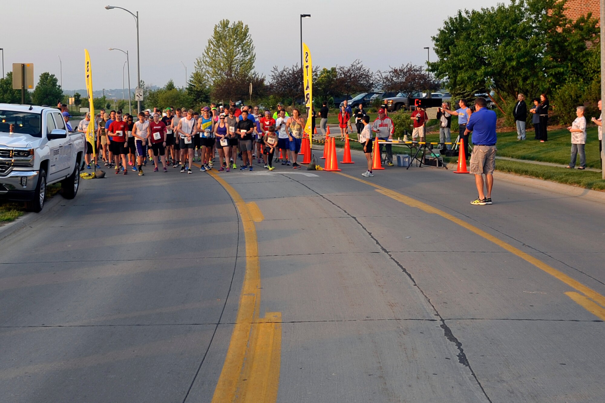 Participants get in place for the eighth annual Bellevue-Offutt Runway Run at Offutt Air Force Base, Neb., May 8, 2016. More than 100 runners participated in this unique seven-mile race that takes runners down Fort Crook Road in Bellevue, Neb. and down an active U.S. Air Force runway on Offutt AFB. (U.S. Air Force photo by Jeff Gates)