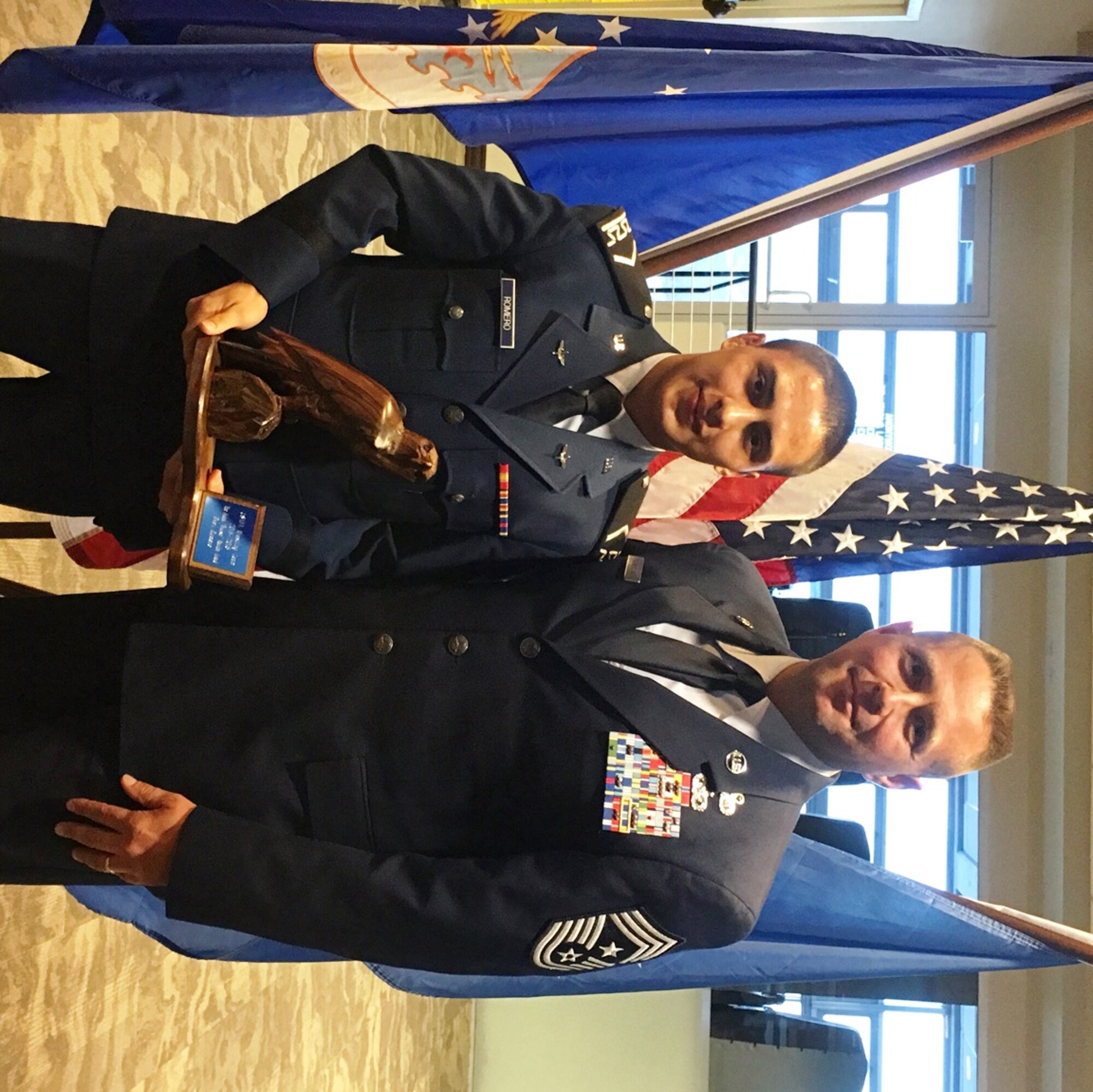 Cadet 3rd Class Drew Romero, a Falcons wrester at the U.S. Air Force Academy, and Chief Master Sgt. Max Grindstaff, the Academy's command chief, pose May 6, 2016, with the Frank Bryant Award. Romero received the award for embodying the Air Force core values, living a championship lifestyle, loving competition, and overcoming adversity to achieve winning results. (U.S. Air Force photo)
