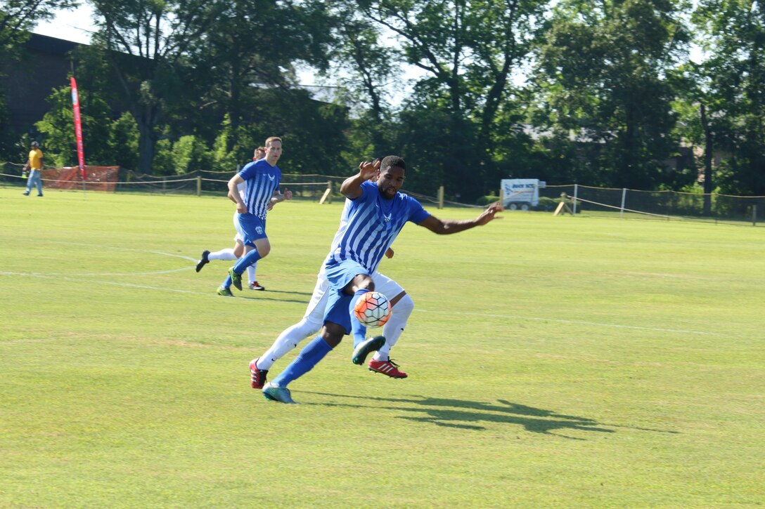 Air Force Midfielder Airman 1st Class Christopher Grant with the ball.  Grant scored two goals as Air Force defeated Marine Corps 5-0 in Match One of the Armed Forces Men's Soccer Championship at Fort Benning, Ga, 6-14 May 2016.