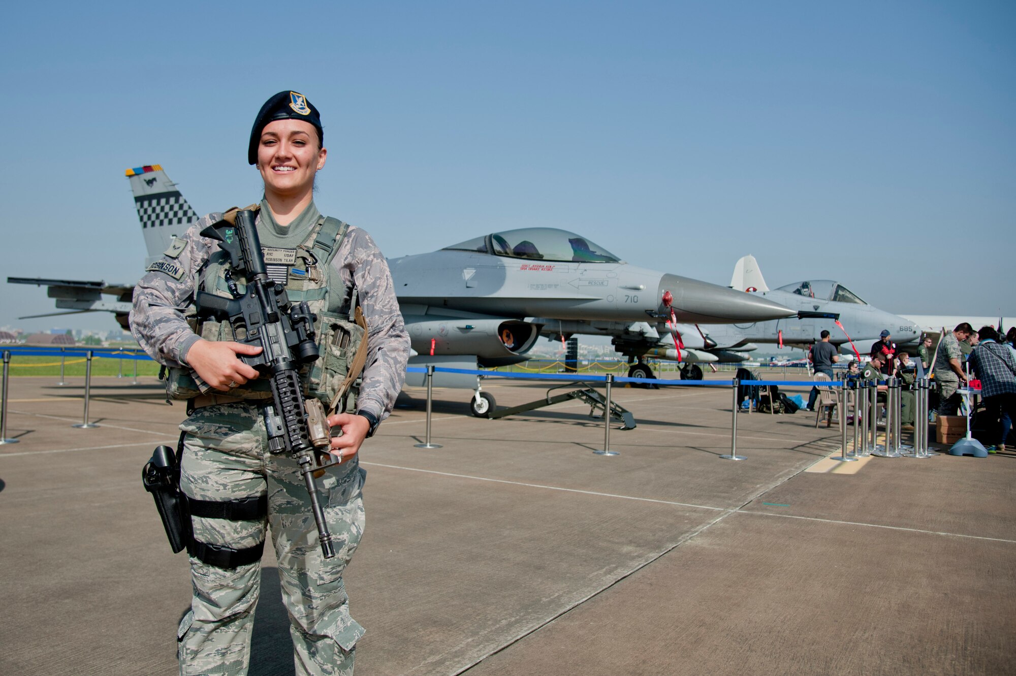 Airman 1st Class Tilar Robinson, 51st Security Forces Squadron entry controller, provides security for F-16 Fighting Falcon and A-10 Thunderbolt II static displays during the Gyeonggi Suwon Airshow 2016 at Suwon Air Base, Republic of Korea, May 7, 2016. The 51st SFS provided round the clock security during the two-day airshow to protect Osan’s aircraft. (U.S. Air Force photo by Staff Sgt. Jonathan Steffen/Released)