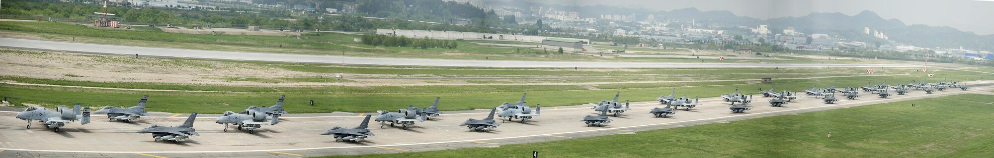 A-10 Thunderbolt II and F-16 Fighting Falcon fighter aircraft perform an 'Elephant Walk' on the runway this week during Exercise Beverly Herd 16-01 at Osan Air Base, Republic of Korea. The Elephant Walk was a demonstration of U.S. Air Force capabilities and strength and showcases the wing's ability to generate combat airpower in an expedient manner in order to respond to simulated contingency operations. The A-10 Thunderbolt II aircraft are the 25th Fighter Squadron "Draggins" and the F-16 Fighting Falcon aircraft are the 36th Fighter Squadron "Friends" from the 51st Fighter Wing, Osan AB, ROK; the additional F-16 aircraft are the 179th Fighter Squadron "Bulldogs" from the 148th Fighter Wing out of Duluth Air National Guard Base, Minnesota. .(U.S. Air Force photo by Staff Sgt. Jonathan Steffen/Released)