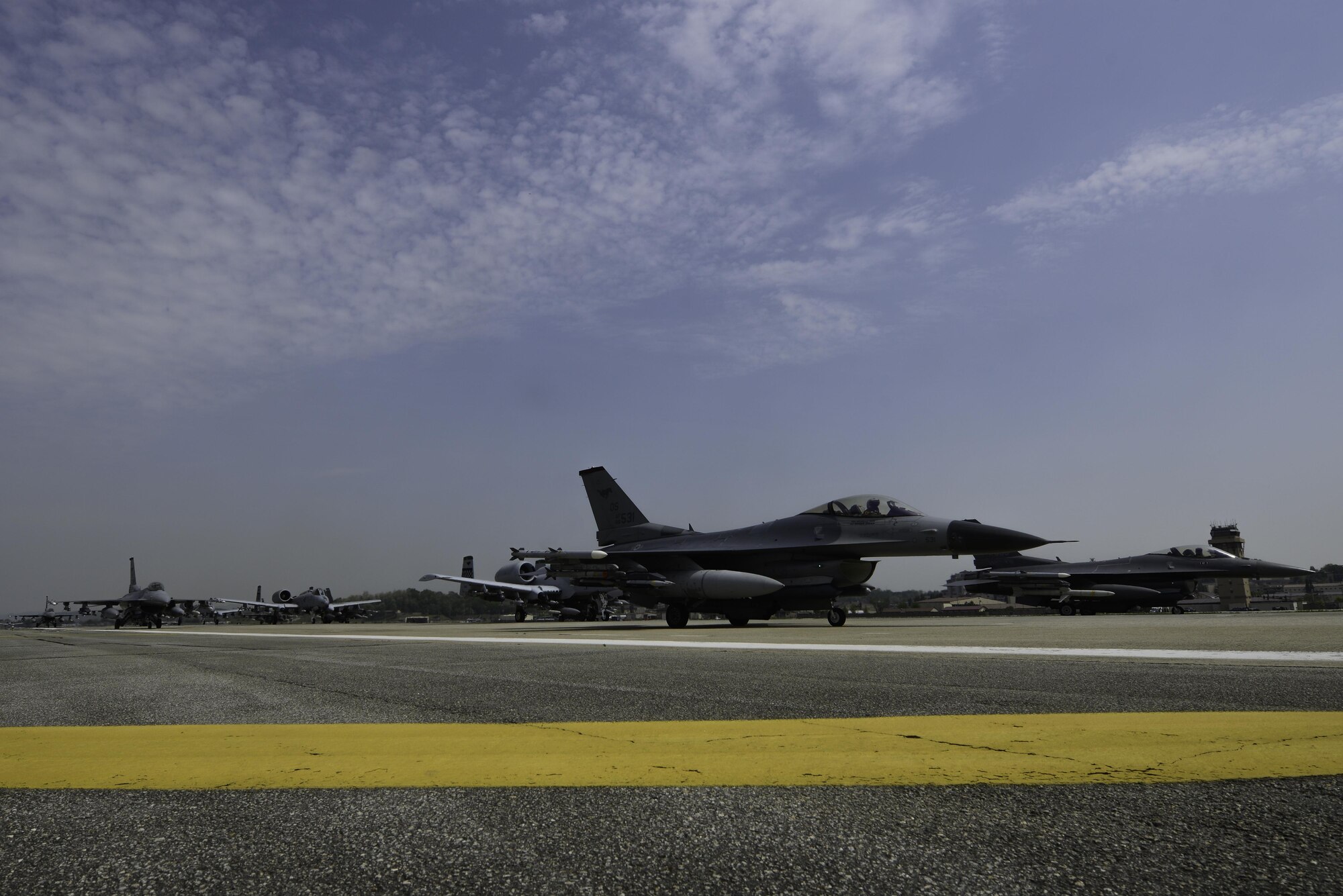 A-10 Thunderbolt II and F-16 Fighting Falcon fighter aircraft perform an 'Elephant Walk' on the runway this week during Exercise Beverly Herd 16-01 at Osan Air Base, Republic of Korea. The Elephant Walk was a demonstration of U.S. Air Force capabilities and strength and showcases the wing's ability to generate combat airpower in an expedient manner in order to respond to simulated contingency operations. The A-10 Thunderbolt II aircraft are the 25th Fighter Squadron "Draggins" and the F-16 Fighting Falcon aircraft are the 36th Fighter Squadron "Friends" from the 51st Fighter Wing, Osan AB, ROK; the additional F-16 aircraft are the 179th Fighter Squadron "Bulldogs" from the 148th Fighter Wing out of Duluth Air National Guard Base, Minnesota. (U.S. Air Force photo by Senior Airman Dillian Bamman/Released)