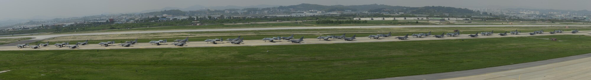 A-10 Thunderbolt II and F-16 Fighting Falcon fighter aircraft perform an 'Elephant Walk' on the runway this week during Exercise Beverly Herd 16-01 at Osan Air Base, Republic of Korea. The Elephant Walk was a demonstration of U.S. Air Force capabilities and strength and showcases the wing's ability to generate combat airpower in an expedient manner in order to respond to simulated contingency operations. The A-10 Thunderbolt II aircraft are the 25th Fighter Squadron "Draggins" and the F-16 Fighting Falcon aircraft are the 36th Fighter Squadron "Friends" from the 51st Fighter Wing, Osan AB, ROK; the additional F-16 aircraft are the 179th Fighter Squadron "Bulldogs" from the 148th Fighter Wing out of Duluth Air National Guard Base, Minnesota. (U.S. Air Force photo by Senior Airman Victor J. Caputo/Released)