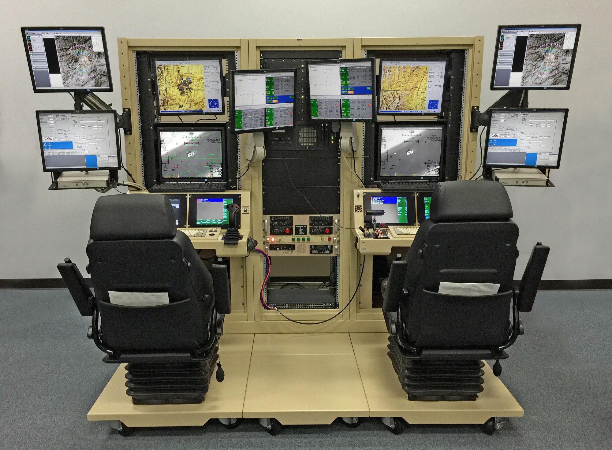 The predator mission aircrew training systems lite is a condensed version of a full-sized simulator which allows MQ-9 Reaper Airmen to replicate an active environment, and exercise launch and recovery, and full-mission operations. With help from the 28th Communications and Civil Engineer Squadrons, the 432nd Attack Squadron is able to save $150,000 and 7,800 man-hours a year. (U.S. Air Force courtesy photo by Lt. Col. Kenneth Degon/Released)