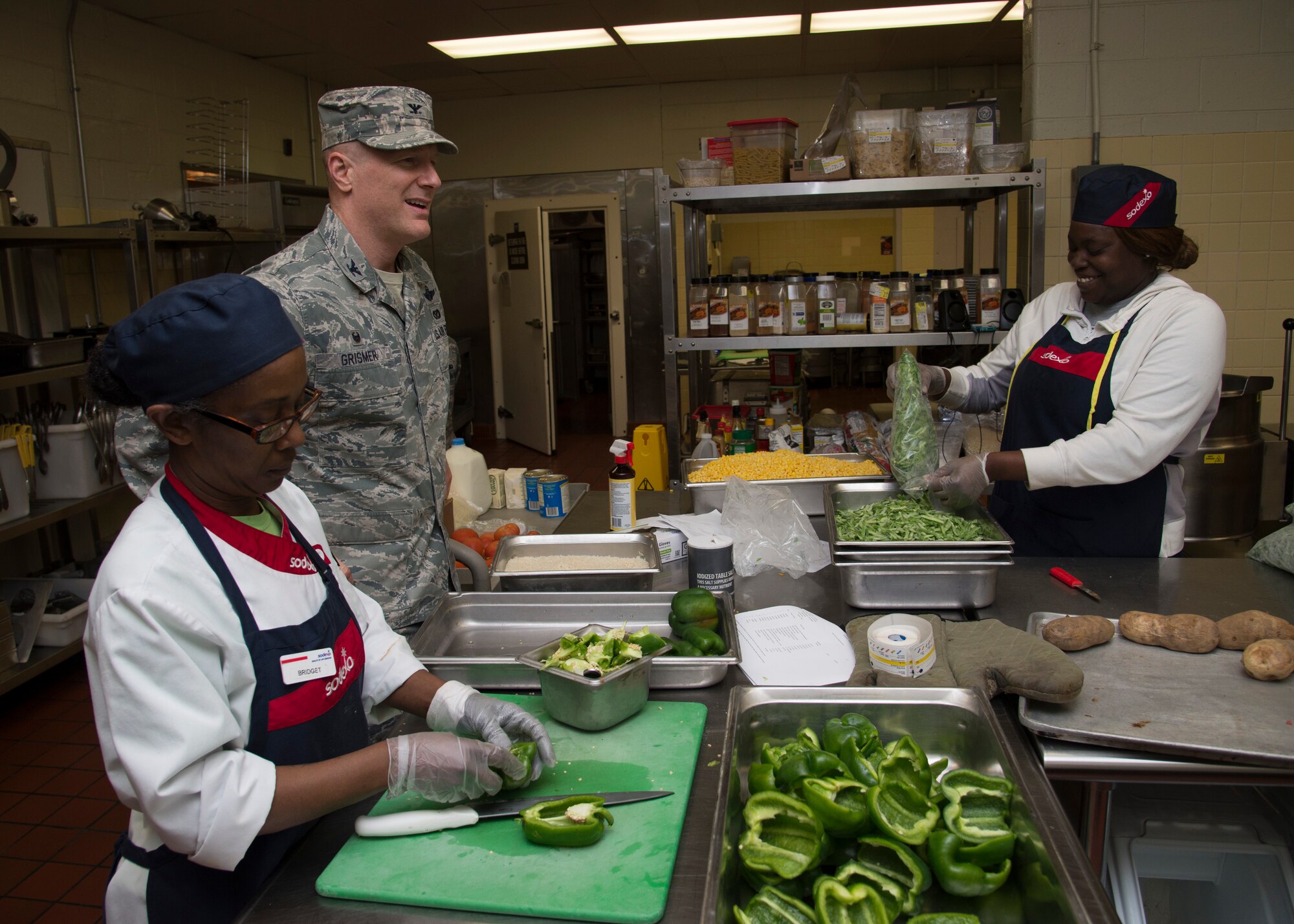 Col. Michael Grismer, 436th Airlift Wing commander, visits the Patterson Dining Facility during leadership by walking around May 4, 2016, on Dover Air Force Base, Del. Grismer took a tour of the DFAC to get a better understanding of its capabilities and to meet with the Airmen and civilian employees. (U.S. Air Force photo/Senior Airman Zachary Cacicia) 