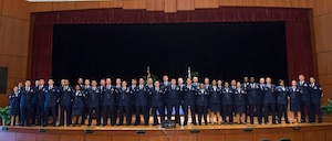 Forty Airmen pose for a group photo during a Community College of the Air Force graduation ceremony May 6, 2016, at Joint Base Charleston, S.C. CCAF was established April 1, 1972 and provides enlisted Airmen a regionally accredited degree through the Air University by the Southern Association of Colleges and Schools. (U.S. Air Force photo/Staff Sgt. Jared Trimarchi)
  

