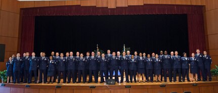 Forty Airmen pose for a group photo during a Community College of the Air Force graduation ceremony May 6, 2016, at Joint Base Charleston, S.C. CCAF was established April 1, 1972 and provides enlisted Airmen a regionally accredited degree through the Air University by the Southern Association of Colleges and Schools. (U.S. Air Force photo/Staff Sgt. Jared Trimarchi)
  
