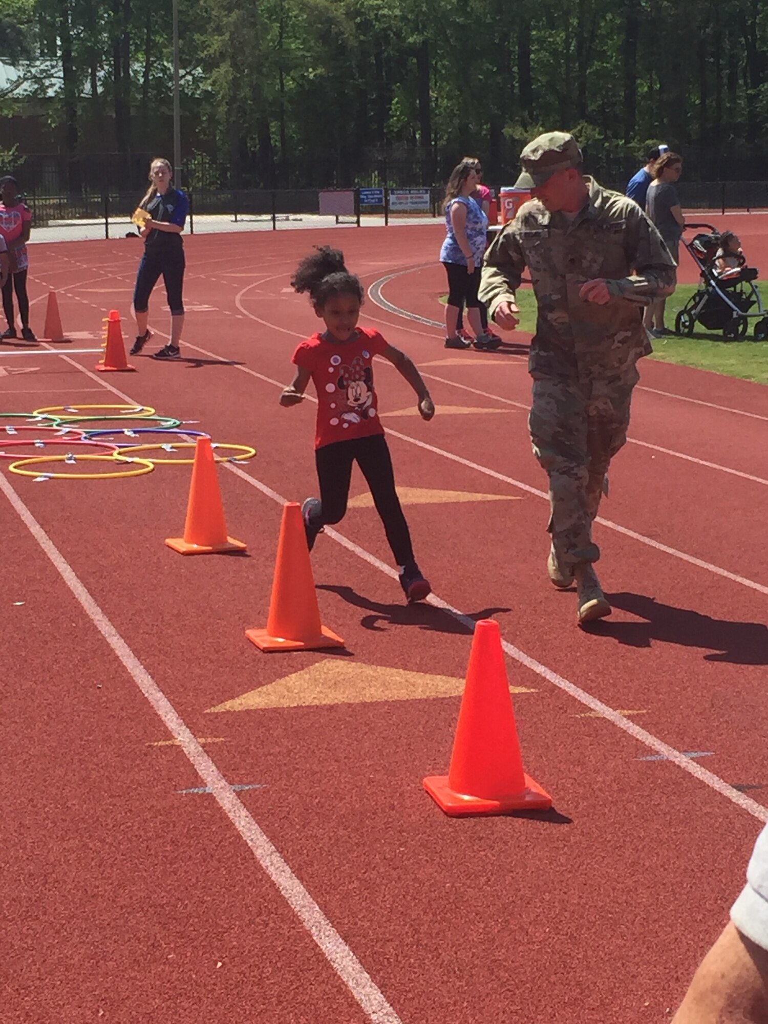 U.S. Army Soldiers from the 689th Rapid Port Opening Element help special needs children through obstacles at the 45th Annual George Green Field Day at Todd Stadium in Newport News, Virginia, April 25, 2015.  The RPOE has volunteered for the field day for the past five years as a way to give back to the local community . (U.S. Army courtesy photo)
