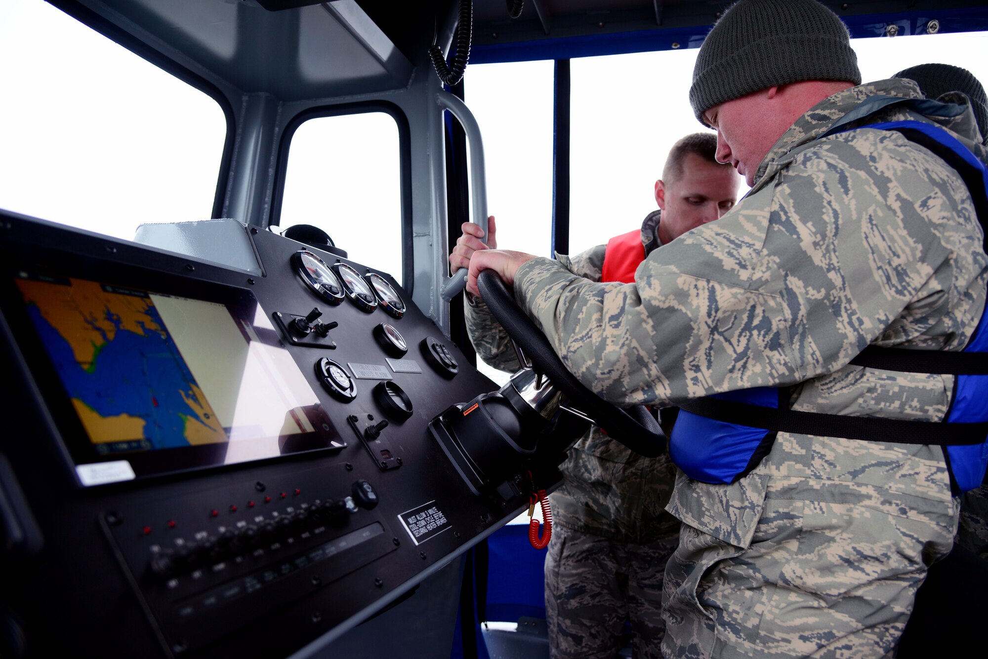 U.S. Air Force Senior Airman Jeremy White, a response force leader with the 633rd Security Forces Squadron, trains on navigating a patrol boat and learning its different functions at Langley Air Force Base, Va., May 5, 2016. This is the first time since 2003 that Langley will have patrols in the surrounding waterways. (U.S. Air Force photo by Senior Airman Kristina LaCoste)


