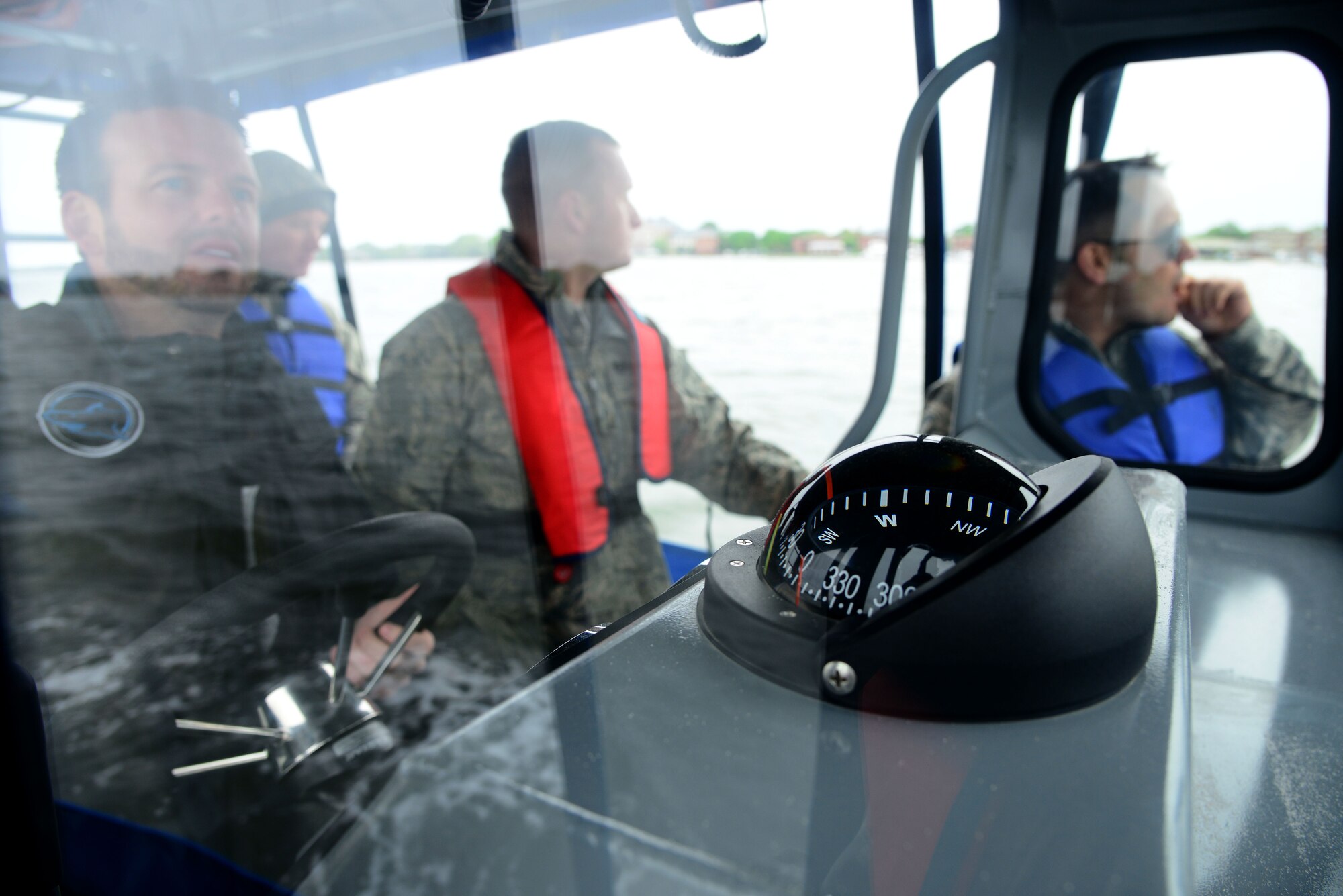 U.S. Airmen assigned to the 633rd Security Forces Squadron learn how to navigate the patrol boat on the Back River at Langley Air Force Base, Va., May 5, 2016. The Airmen learned about the different controls and how to work safely in the event of a pursuit. (U.S. Air Force photo by Senior Airman Kristina LaCoste)