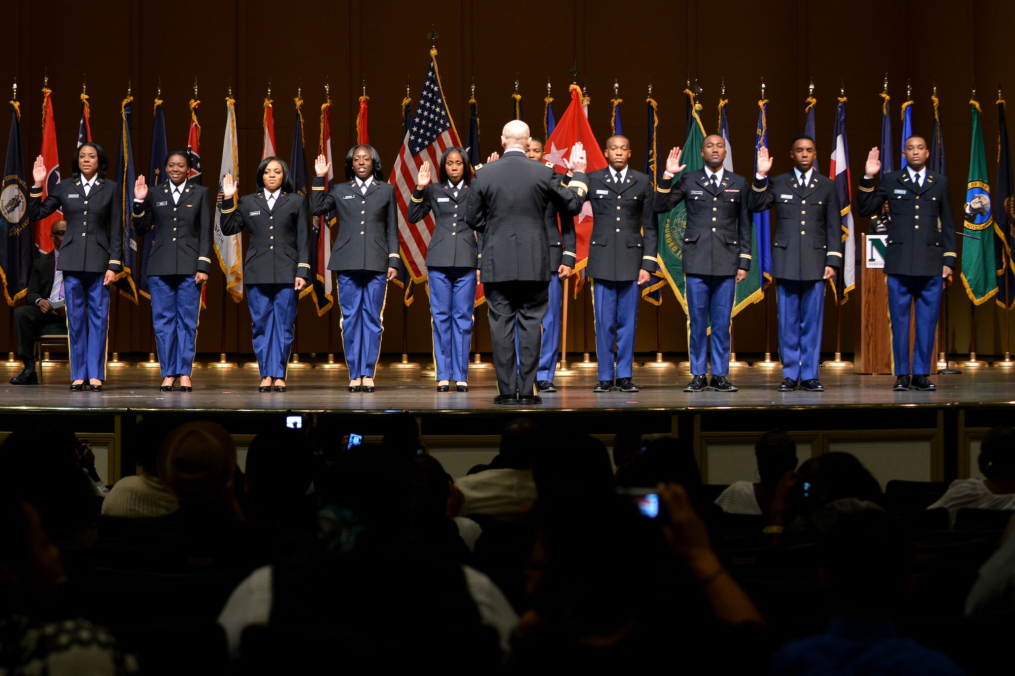 U.S. Army Maj. Gen. Anthony C. Funkhouser, the commander of the Center for Initial Military Training, commissions Army Reserve Officer Training Corps cadets into the U.S. Army at the Norfolk State University Spring Commissioning Ceremony in Norfolk, Va., May 6, 2016. The Army ROTC program at the college has commissioned more than 760 Army officers since 1969. (U.S. Air Force photo by Staff Sgt. Natasha Stannard)
