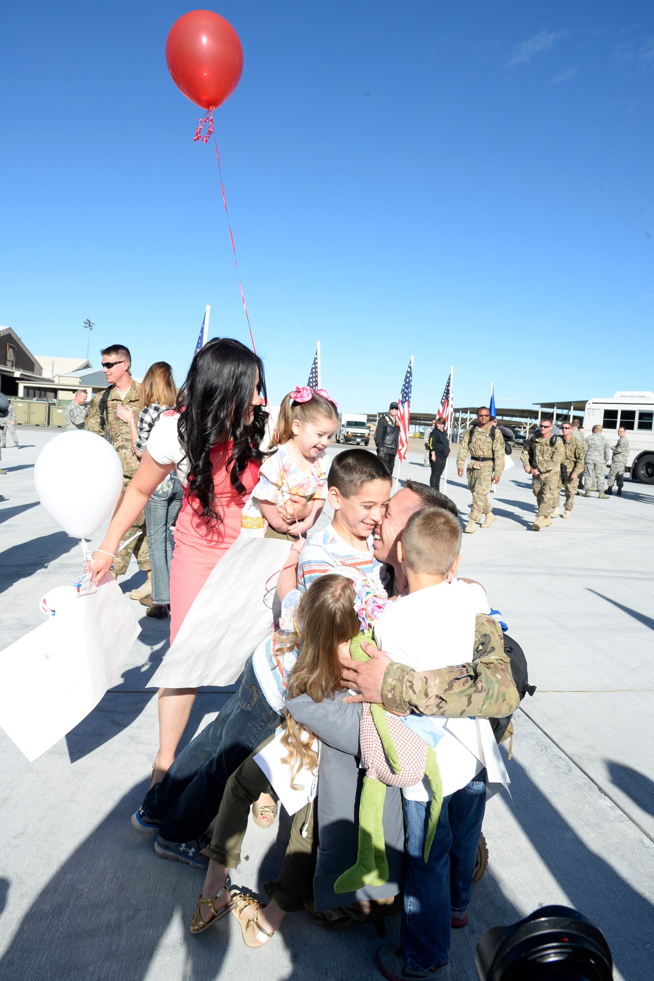 Master Sgt. Chris Aguilar, 421st Fighter Squadron, is welcomed home by his family – spouse Natilie and children Eric, Evan, Elise and Emily – at Hill Air Force Base, Utah, May 10th, 2016. Aguilar arrived home after completing a nearly 8-month deployment supporting Operation Freedom’s Sentinel in Afghanistan. While deployed, the 421st Fighter Squadron flew more than 2,800 sorties and spent more than 10,000 hours in the skies, dropping more than 100 guided bombs, primarily in support of coalition troops on the ground. As the only dedicated fighter unit in Afghanistan, the 421st Fighter Squadron provided 24/7 air support to coalition forces. (U.S. Air Force photo by Todd Cromar)