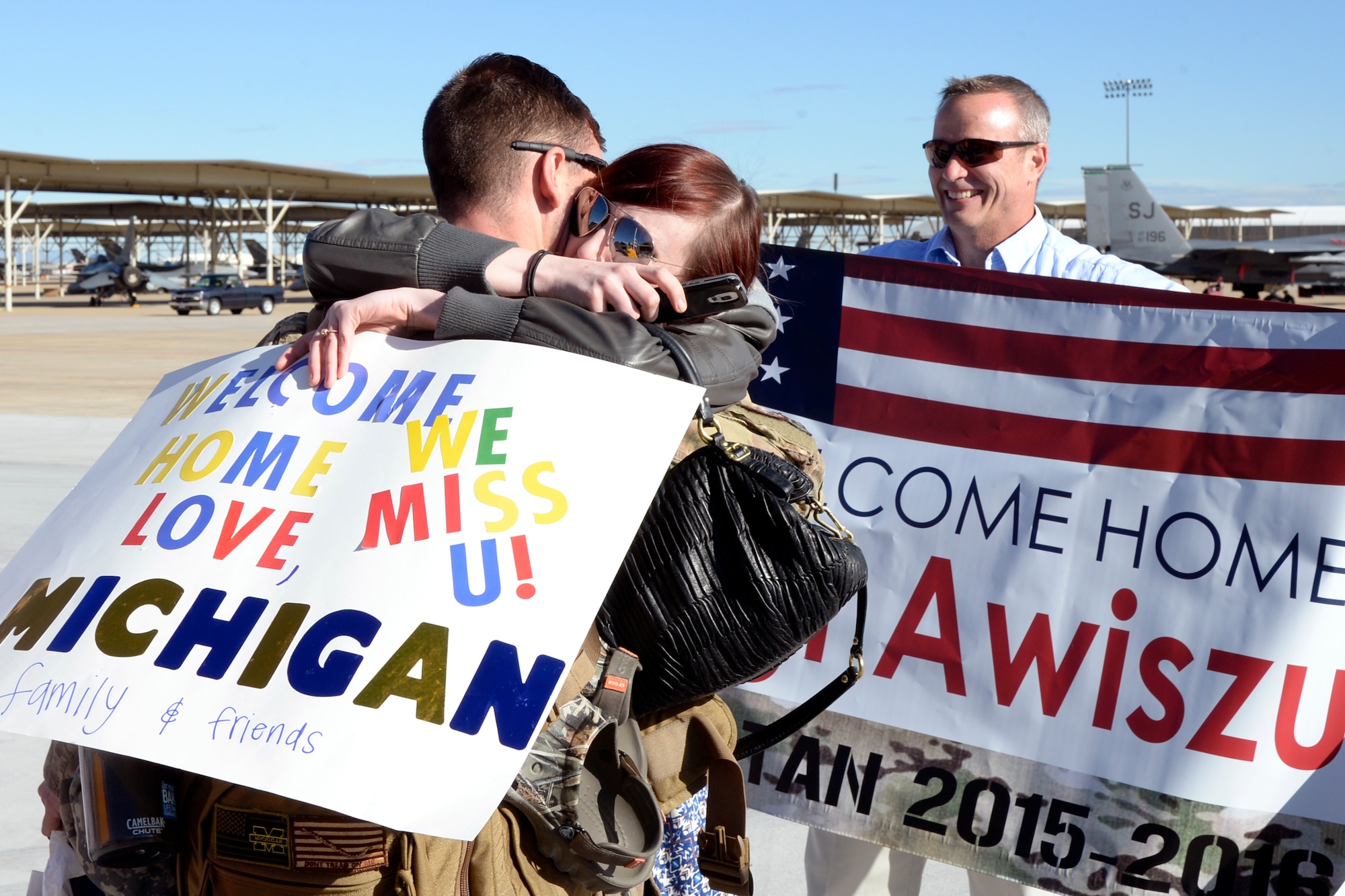 Staff Sgt. Jacob Awiszus, 421st Fighter Squadron, is welcomed home May 10 at Hill Air Force Base by Arron and Hugh Trout. Awiszus spent nearly eight months supporting Operation Freedom’s Sentinel in Afghanistan. (U.S. Air Force photo by Todd Cromar)