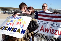Staff Sgt. Jacob Awiszus, 421st Fighter Squadron, is welcomed home May 10 at Hill Air Force Base by Arron and Hugh Trout. Awiszus spent nearly eight months supporting Operation Freedom’s Sentinel in Afghanistan. (U.S. Air Force photo by Todd Cromar)