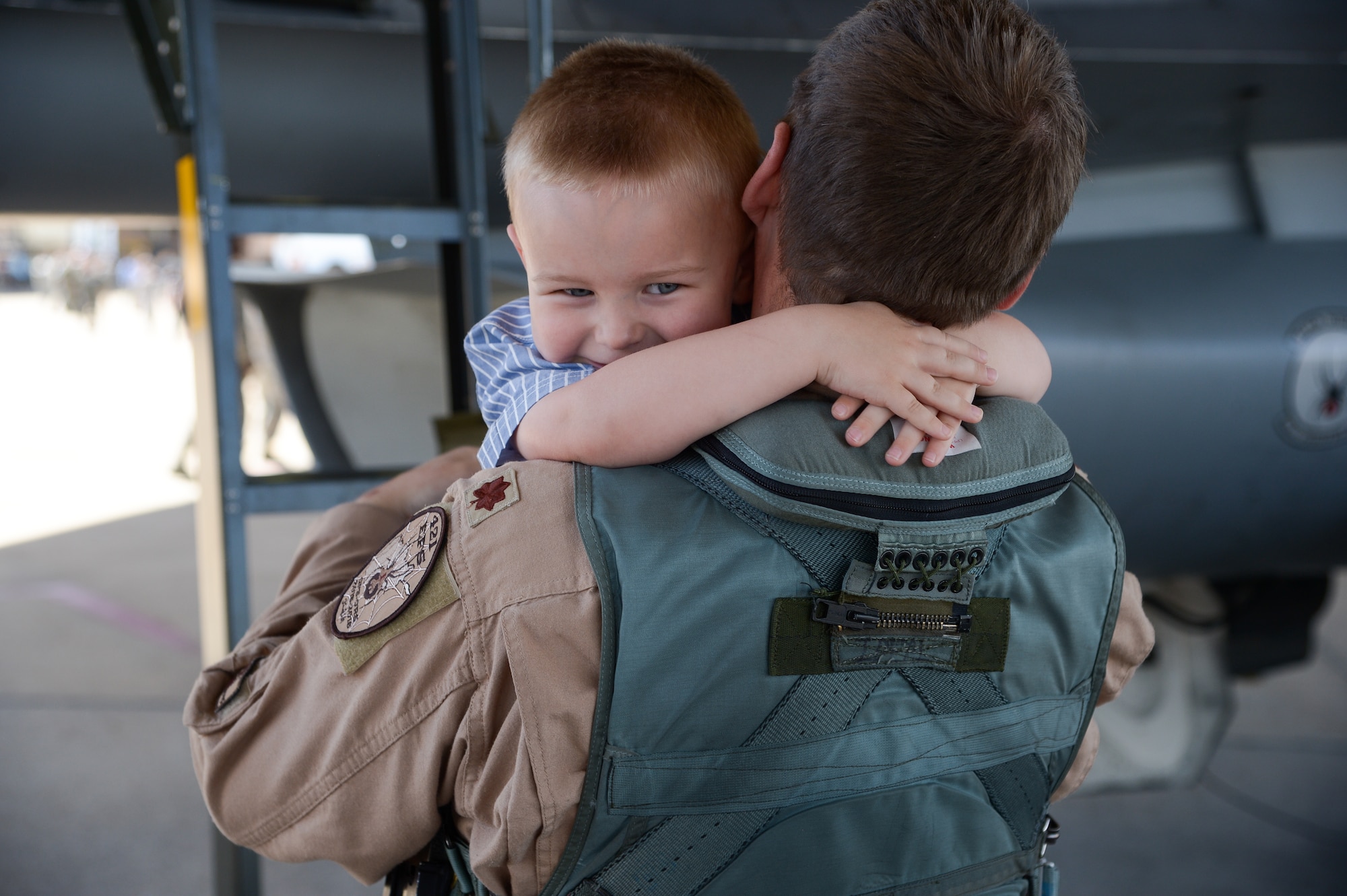 Maj. Geffrey Gebhardt, an F-16 Fighting Falcon aircraft pilot assigned to the 421st Fighter Squadron, greets his son Grayson May 4 at Hill Air Force Base, Utah. Gebhardt returned to the base after a nearly 8-mnth deployment to Afghanistan in support of Operation Freedom’s Sentinel. While deployed, the 421st Fighter Squadron flew more than 2,800 sorties and spent more than 10,000 hours in the skies, dropping more than 100 guided bombs, primarily in support of coalition troops on the ground. As the only dedicated fighter unit in Afghanistan, the 421st Fighter Squadron provided 24/7 air support to coalition forces. (U.S. Air Force photo by R. Nial Bradshaw)