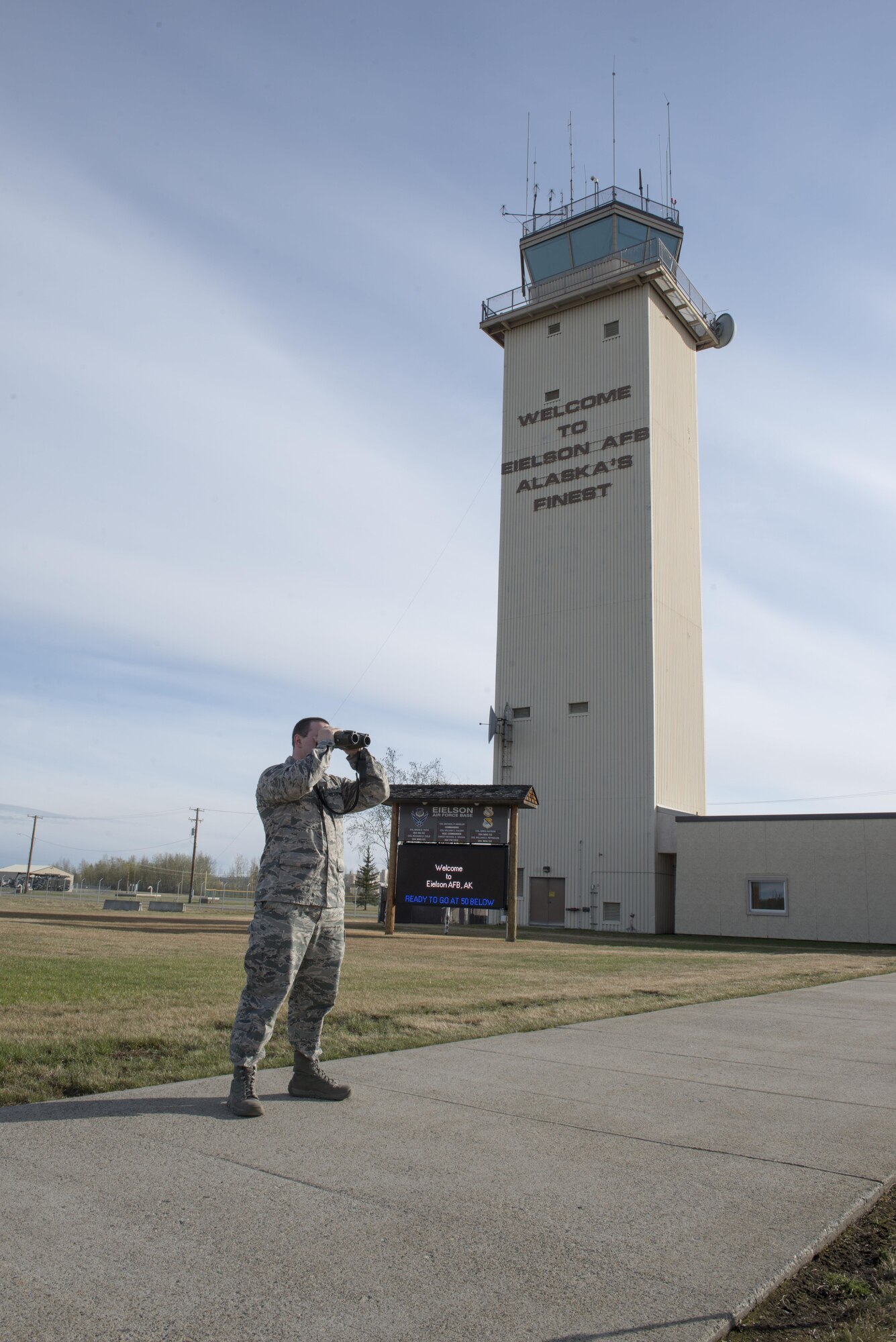 U.S. Air Force Staff Sgt. Cody Howk, a 354th Operations Support Squadron (OSS) weather technician, uses a range finder to check visibility, May 4, 2016, at Eielson Air Force Base, Alaska. The OSS plays an important role during RED FLAG-Alaska 16-1 to ensure pilots know the exact weather conditions when they perform sorties. (U.S. Air Force photo by Staff Sgt. Ashley Nicole Taylor/Released)