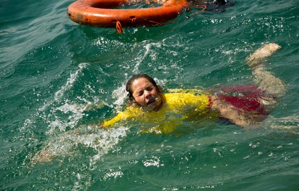 A Honduran Naval trainee performs a swimming aptitude test April 4, 2016 along the northern coast of Honduras. The test helped to establish proficiency in the water and to better develop the skills of the entire training class, during the first-ever consolidated infantry course hosted by the Honduran Navy. (U.S. Air Force photo by Capt. Christopher Mesnard) 