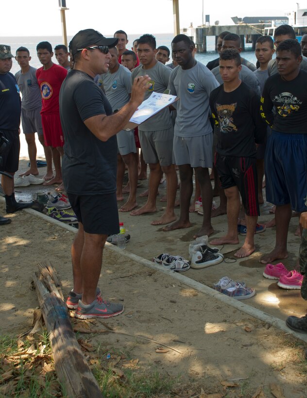 Honduran Navy Captain, Jose Gonzalez, provides feedback to a class of enlisted Honduran Naval trainees April 4, 2016, along the northern coast of Honduras. The trainees conducted a swimming aptitude test to establish their proficiency in the water and to better develop their skills as a group, during the first-ever consolidated infantry course hosted by the Honduran Navy. (U.S. Air Force photo by Capt. Christopher Mesnard/not released) 