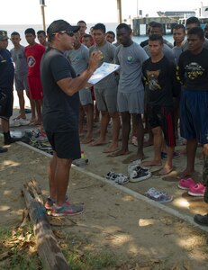 Honduran Navy Captain, Jose Gonzalez, provides feedback to a class of enlisted Honduran Naval trainees April 4, 2016, along the northern coast of Honduras. The trainees conducted a swimming aptitude test to establish their proficiency in the water and to better develop their skills as a group, during the first-ever consolidated infantry course hosted by the Honduran Navy. (U.S. Air Force photo by Capt. Christopher Mesnard/not released) 