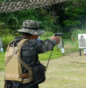 A Honduran Navy trainer demonstrates a basic live-fire drill for Honduran trainees April 5, 2016, along the northern coast of Honduras. The trainers are conducting the first ever consolidated course for basic infantry skills for the Honduran Navy, giving them a set of common skills to draw upon during counter-narcotic operations. (U.S. Air Force photo by Capt. Christopher Mesnard)