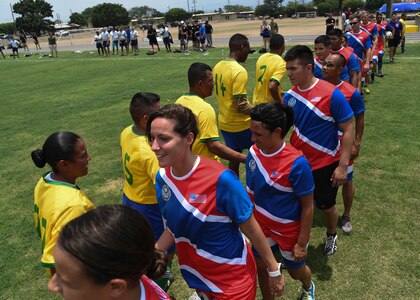 Members of the Joint Task Force-Bravo and Honduran Military Training Academy soccer teams shake hands following their match during the 2016 Camaraderie Day at Soto Cano Air Base, Honduras, May 5, 2016. The day was designed to celebrate the partnership between the armed forces of the U.S. and Honduras through friendly competition. (U.S. Air Force photo by Staff Sgt. Siuta B. Ika)