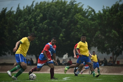 Members of the Honduran Military Training Academy soccer team attempt to advance the ball during the 2016 Camaraderie Day at Soto Cano Air Base, Honduras, May 5, 2016. The day was designed to celebrate the partnership between the armed forces of the U.S. and Honduras through friendly competition. (U.S. Air Force photo by Staff Sgt. Siuta B. Ika)