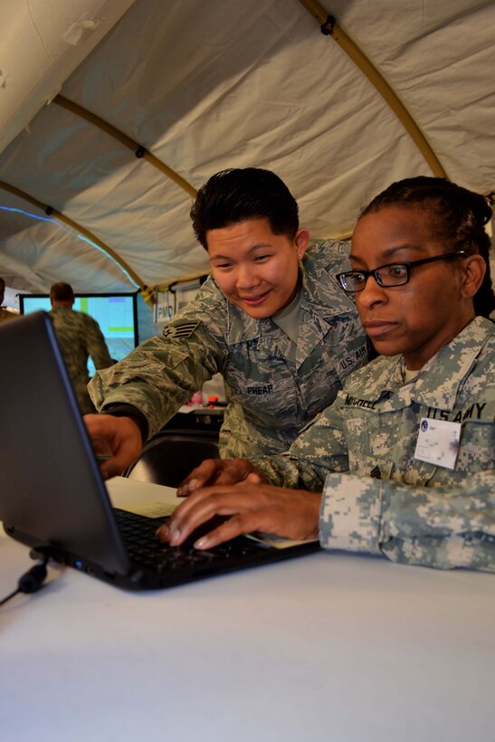 Staff Sgt. Rosie Pheap, a 111th Attack Wing member at Horsham Air Guard Station, Pennsylvania, assists the participants of exercise Anakonda Response 2016, with technology and communications matters at Papa Air Base, Hungary, April 30, 2016. Of the nearly 160 U.S. military members participating in the exercise, a band of less than 10  111th ATKW members represented nearly the entire Air Force component. (U.S. Air National Guard photo by Tech. Sgt. Andria Allmond)
