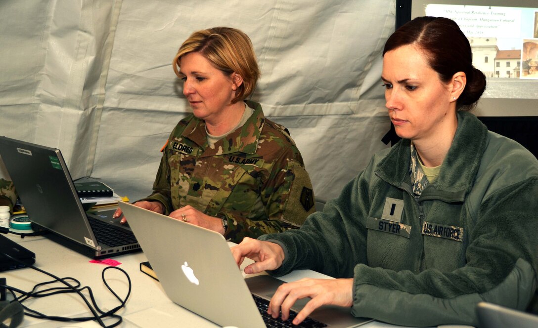 Air National Guard 1st Lt. Hilary Styer, the 111th Attack Wing judge advocate at Horsham Air Guard Station, Pennsylvania, works alongside Army Reserve Lt. Col. Carla Eldred, from the 7th Mission Support Command out of Kaiserslautern, Germany, during exercise Anakonda Response 2016 at Papa Air Base, Hungary, May 1, 2016. The international, joint-branch exercise was an evaluation hosted by the Hungarian Ministry of Defense. (U.S. Air National Guard photo by Tech. Sgt. Andria Allmond)
