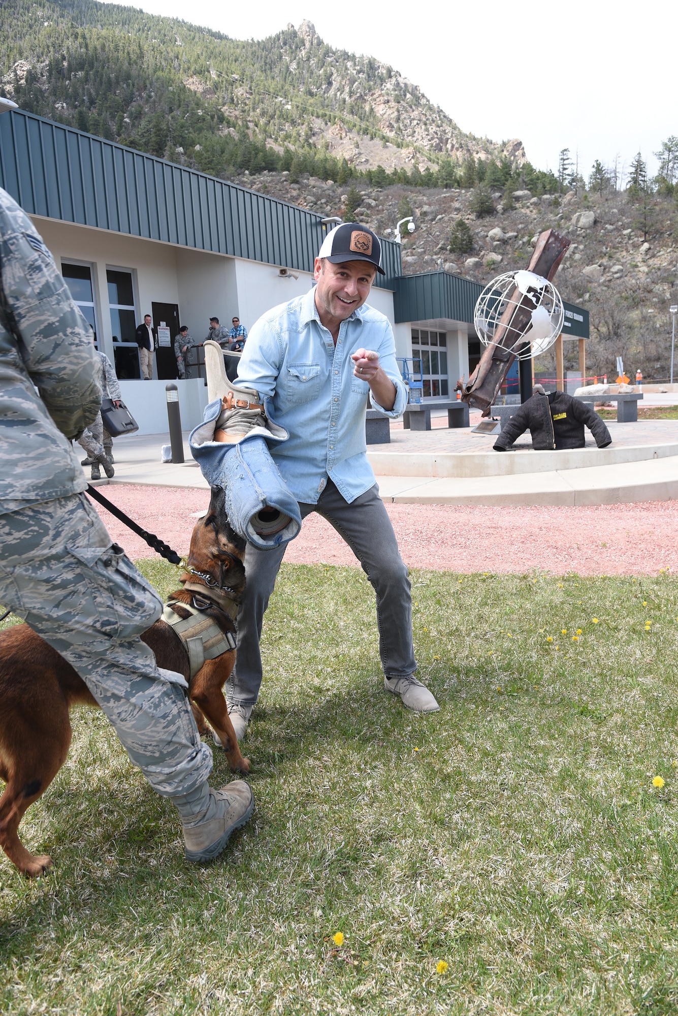 CHEYENNE MOUNTAIN AIR FORCE STATION, Colo. – Actor and comedian Steve Lemme, a member of the comedy troupe Broken Lizard and star of the film “Super Troopers” participates in a Military Working Dog demonstration at the Mountain on May 6, 2016. The 21st Security Forces educated the actors on the capabilities of the MWD program. Lemme and comedy partner Kevin Heffernan visited and toured the facility, and signed autographs for CMAFS Airmen. The visit was part of the ongoing CMAFS 50th Anniversary celebration. (U.S. Air Force photo by Airman 1st Class Dennis Hoffman)