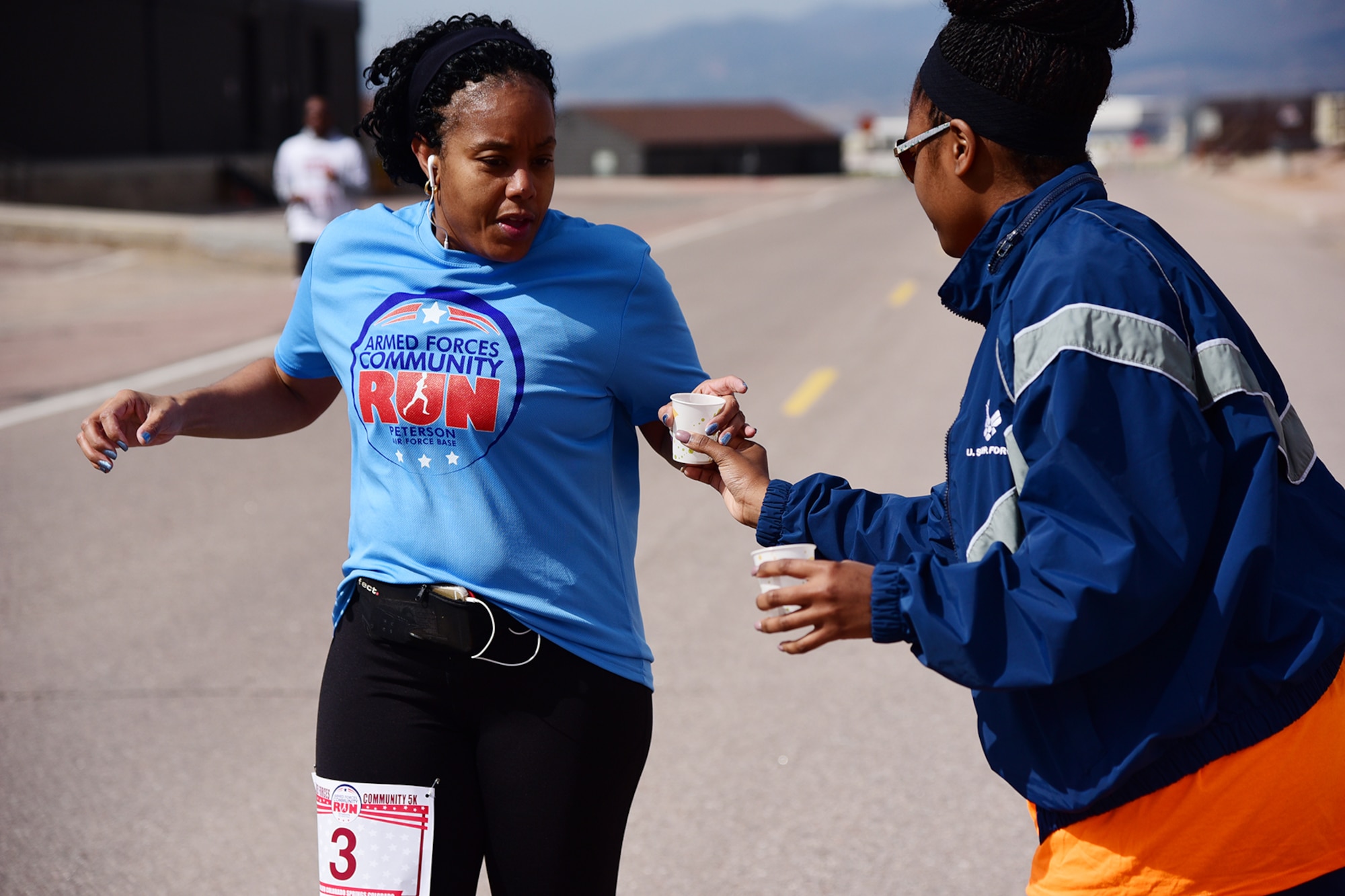 PETERSON AIR FORCE BASE, Colo.- Hydration stations were set up across the base to provide water for the runners of this year’s Annual Armed Forces Community 10K/5K Run on May 7, 2016. Participants in the run were treated to free food, live music and a view of the Rocky Mountains from Peterson’s flightline.  (U.S. Air Force photo/Staff Sgt. Amber Grimm)