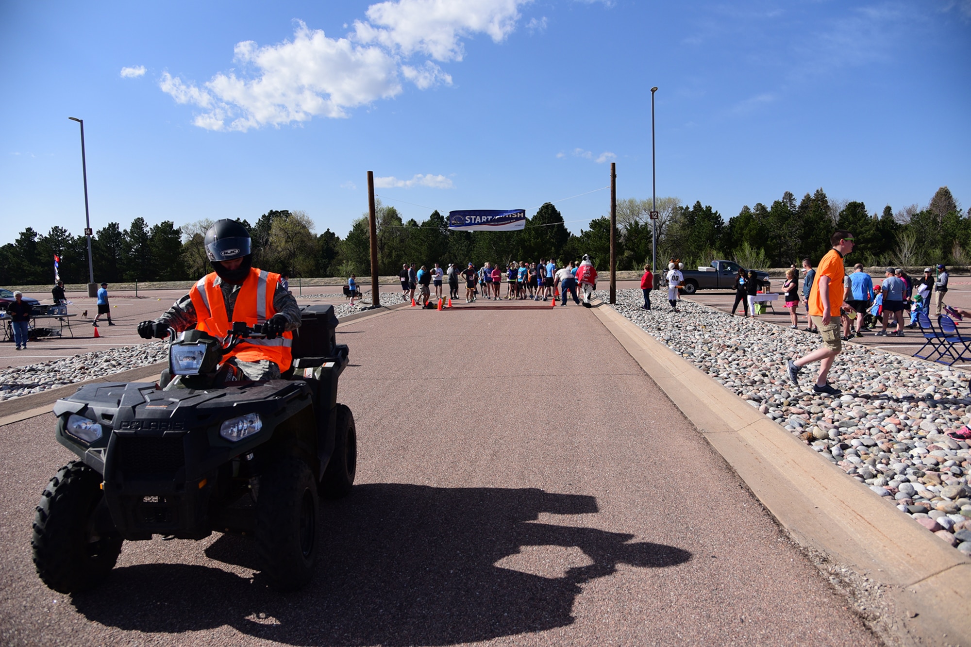 PETERSON AIR FORCE BASE, Colo.- Runners line up for the official start of the Annual Armed Forces Community 10K/5K Run on May 7, 2016. Participants were able to sign up for either distance run, which took place through various areas at Peterson. (U.S. Air Force photo/Staff Sgt. Amber Grimm)