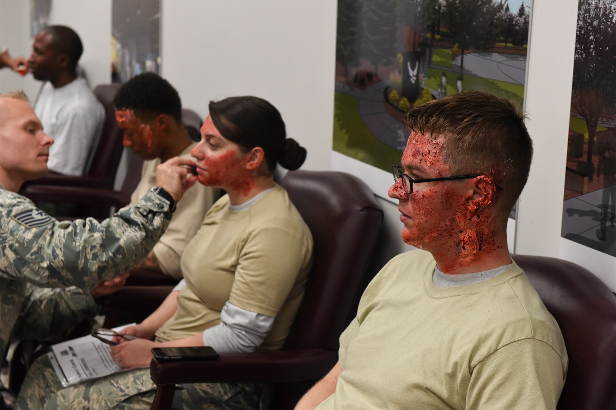 PETERSON AIR FORCE BASE, Colo. – Moulage is applied to volunteer Airmen from the 21st Space Wing during Condor Crest at Peterson Air Force Base, Colo., April 27, 2016. The Airmen volunteered to be participants in a simulated chemical attack. This exercise is designed to evaluate the wing’s readiness for real-world events. (U.S. Air Force photo by Philip Carter)    