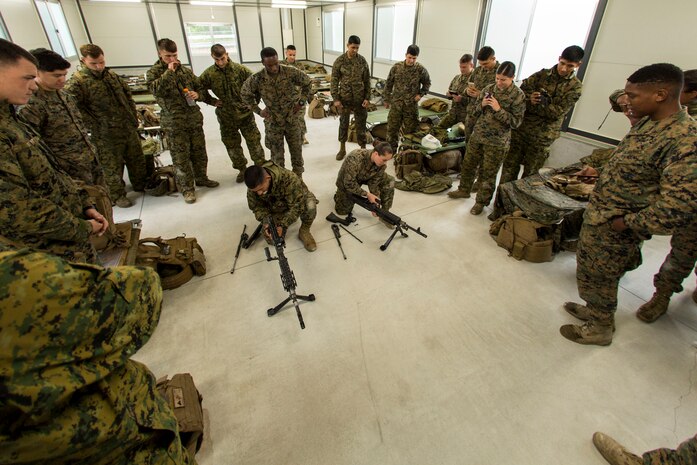 Marines with Marine Wing Support Squadron (MWSS) 171 assemble and disassemble M240 Bravo Light-Machine Guns during exercise Thunder Horse 16.2 at the Japan Ground Self-Defense Force’s Haramura Maneuver Area in Hiroshima, Japan, May 9, 2016. The squadron plans to conduct various drills pertaining to aviation ground support forces, aircraft salvage and recovery, convoys, direct refueling, recovery and general engineering operations, establishing a tactical motor pool, providing air operations and planning expeditionary fire rescue services. (U.S. Marine Corps photo by Lance Cpl. Aaron Henson/Released)