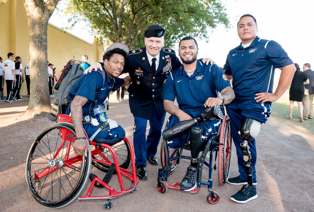 Army Command Sgt. Maj. John W. Troxell, center left, senior enlisted advisor to the chairman of the Joint Chiefs of Staff, poses for a photograph with U.S. team members before the 2016 Invictus Games opening ceremonies in Orlando, Fla., May 8, 2016. DoD photo by Army Staff Sgt. Sean K. Harp