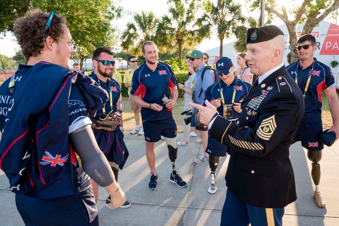 Army Command Sgt. Maj. John W. Troxell, right, senior enlisted advisor to the chairman of the Joint Chiefs of Staff, speaks to athletes from Great Britain before the 2016 Invictus Games opening ceremonies in Orlando, Fla., May 8, 2016. DoD photo by Army Staff Sgt. Sean K. Harp