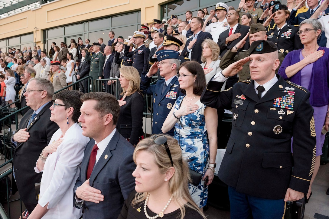 Deputy Defense Secretary Bob Work; his wife, Cassandra; acting Army Secretary Patrick J. Murphy; his wife, Jennifer Safford; Air Force Secretary Deborah Lee James; Air Force Gen. Paul J. Selva, vice chairman of the Joint Chiefs of Staff; his wife, Ricki; and Army Command Sgt. Maj. John W. Troxell, senior enlisted advisor to the chairman of the Joint Chiefs of Staff, render honors during the 2016 Invictus Games opening ceremonies in Orlando, Fla., May 8, 2016. DoD photo by Army Staff Sgt. Sean K. Harp