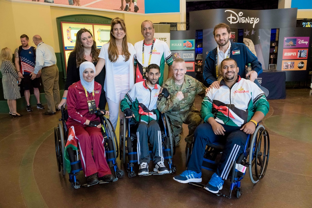 Army Command Sgt. Maj. John W. Troxell, center lower right, senior enlisted advisor to the chairman of the Joint Chiefs of Staff, poses for a photograph with Jordanian athletes at the 2016 Invictus Games opening ceremonies in Orlando, Fla., May 9, 2016. DoD photo by Army Staff Sgt. Sean K. Harp 