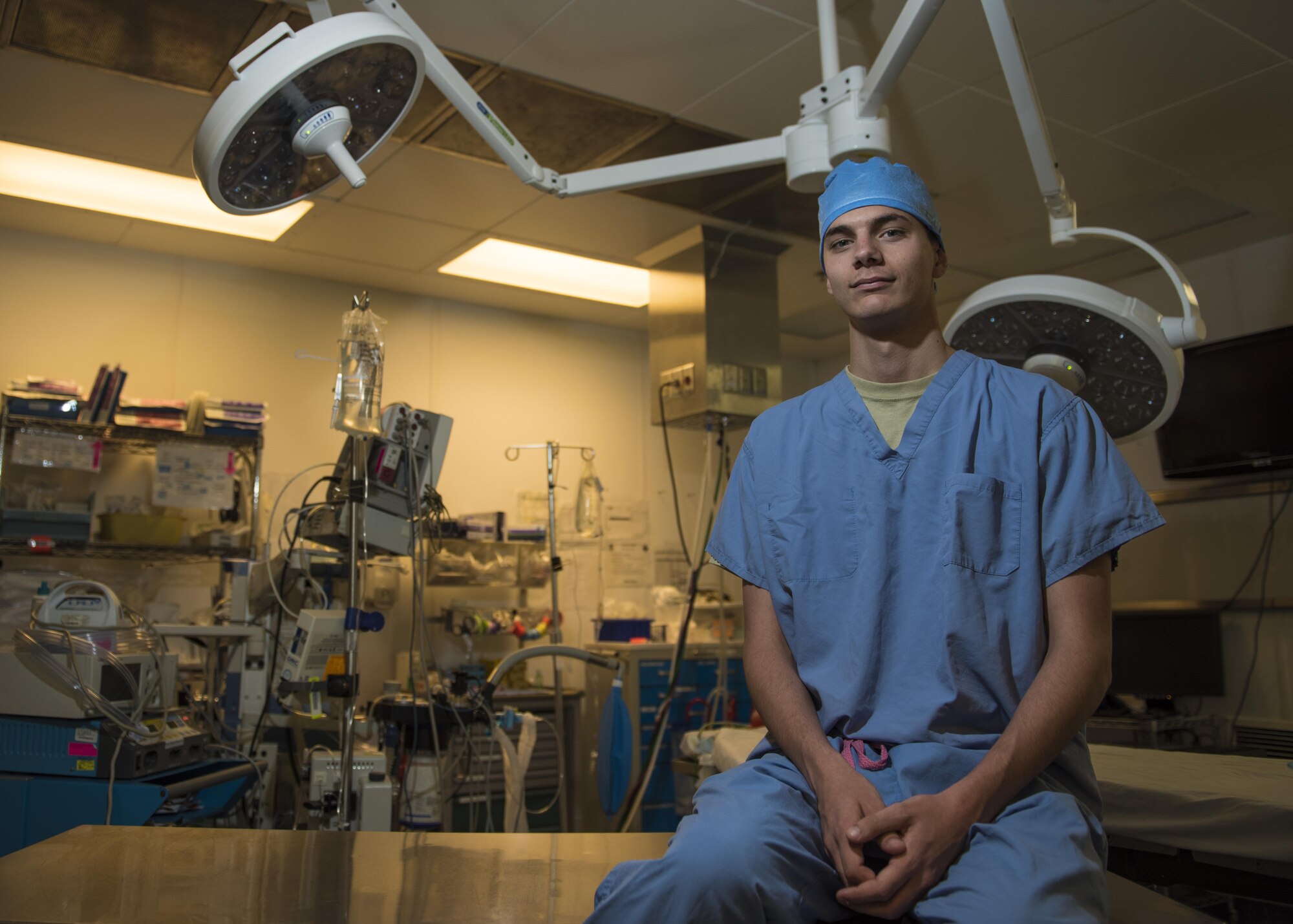 Senior Airman William McNeill, 455th Expeditionary Medical Operations Squadron surgical technician, works in an operating room at the Craig Joint-Theater Hospital, Bagram Airfield, Afghanistan, May 10, 2016. McNeill, who used to be a Security Forces Airman, cross trained into the position he is now after hurting his shoulder. (U.S. Air Force photo by Senior Airman Justyn M. Freeman)