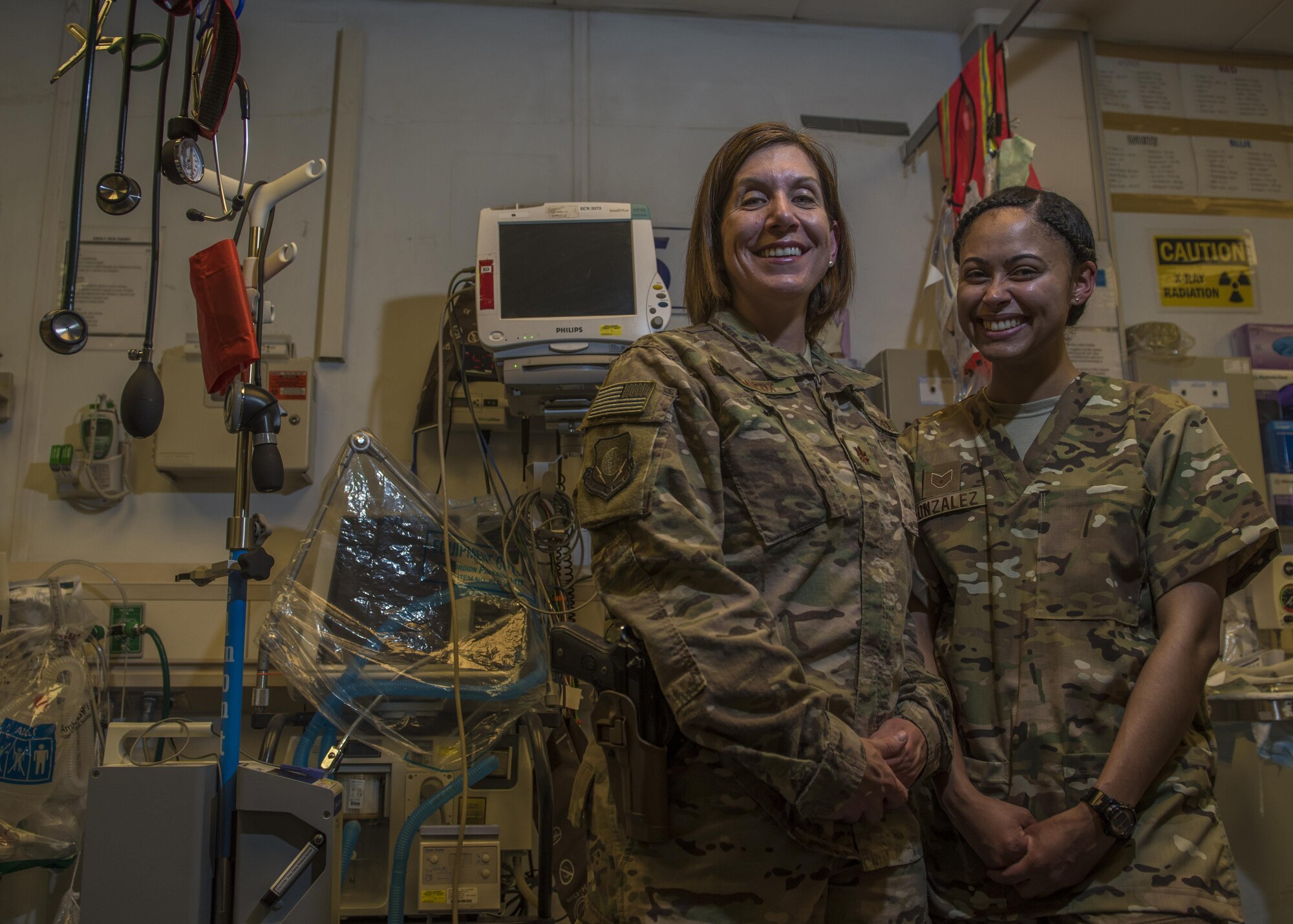 Maj. Jill Leminuex (left), 455th Expeditionary Medical Operations Squadron emergency nurse, and Staff Sgt. Ashley Gonzales (right), 455th EMOS medical technician, work in the Emergency Room at the Craig Joint-Theater Hospital, Bagram Airfield, Afghanistan, May 10, 2016. Leminuex comes to Bagram from the Wright-Patterson Medical Center and Gonzales is an Air Force Reservist that is a nurse in the civilian sector. (U.S. Air Force photo by Senior Airman Justyn M. Freeman)