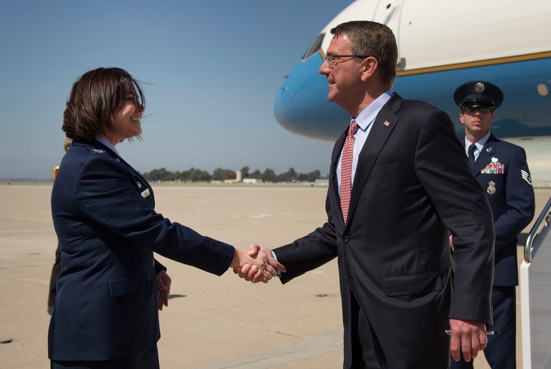 Defense Secretary Ash Carter shakes hands with Air Force Col. Rosemary M. Smith, commander of the 129th Maintenance Group, as he arrives at Moffett Field near Mountain View, Calif., May 10, 2016. Carter traveled to California to visit Defense Innovation Unit Experimental and continue his outreach to innovators in the technology sector. DoD photo by Air Force Senior Master Sgt. Adrian Cadiz