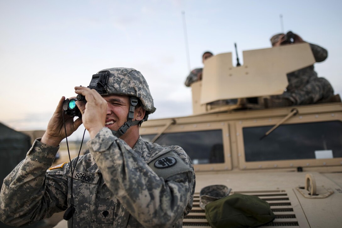 Army Spc. Bradley Schopf tests a lens before a night-fire qualification at Fort Hunter Liggett, Calif., May 3, 2016. Schopf is a military police officer assigned to the 341st Military Police Company. Army photo by Master Sgt. Michel Sauret