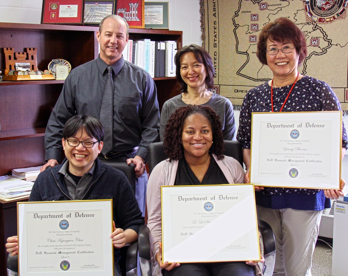 Employees of the Far East District Resource Management Office showcase their DoD Financial Management Certifications.  
Sitting: Chris Choi, LaShun Medlock. Standing: Robert Derrane, Haekyung Cho and Young Phoenix (Young Jin and Sgt. 1st Class Diomedes Tuazon were unavailable).