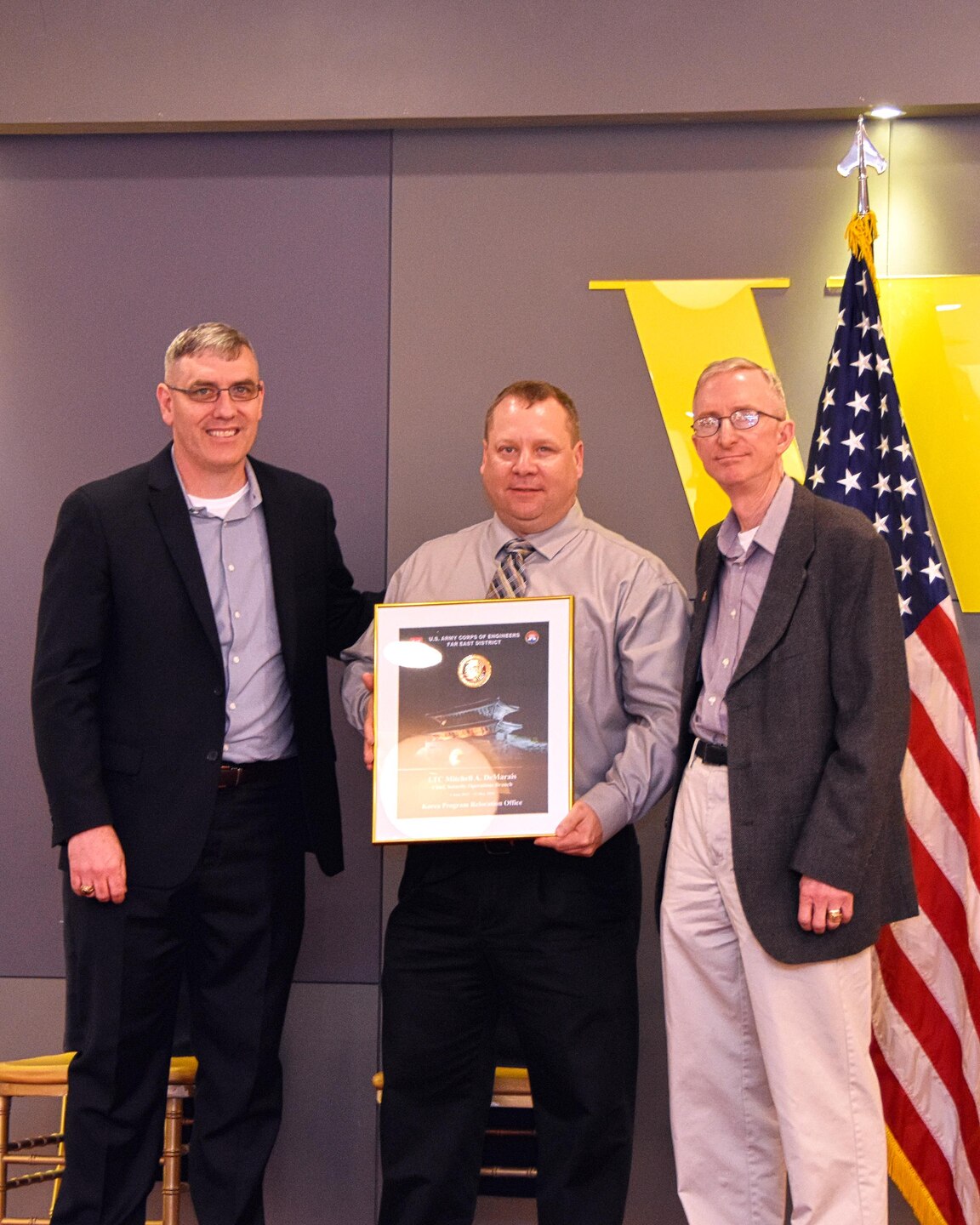 Col. Stephen Bales, commander of the Far East District (left), poses with Lt. Col. Demarais (center) and Maj. Gen. James T. Walton, director of USFK Transformation and Restationing. 

Col. Philip A. Keller, Col. Michael D. Nyenhuis and Lt. Col. Mitchell A. DeMarais were honored at a hosted dinner on Friday, April 22, 2016, which was presided over by Maj. Gen. James T. Walton, and sponsored by a senior Far East District employee. The three officers had more than 90 years of combined service between them.
