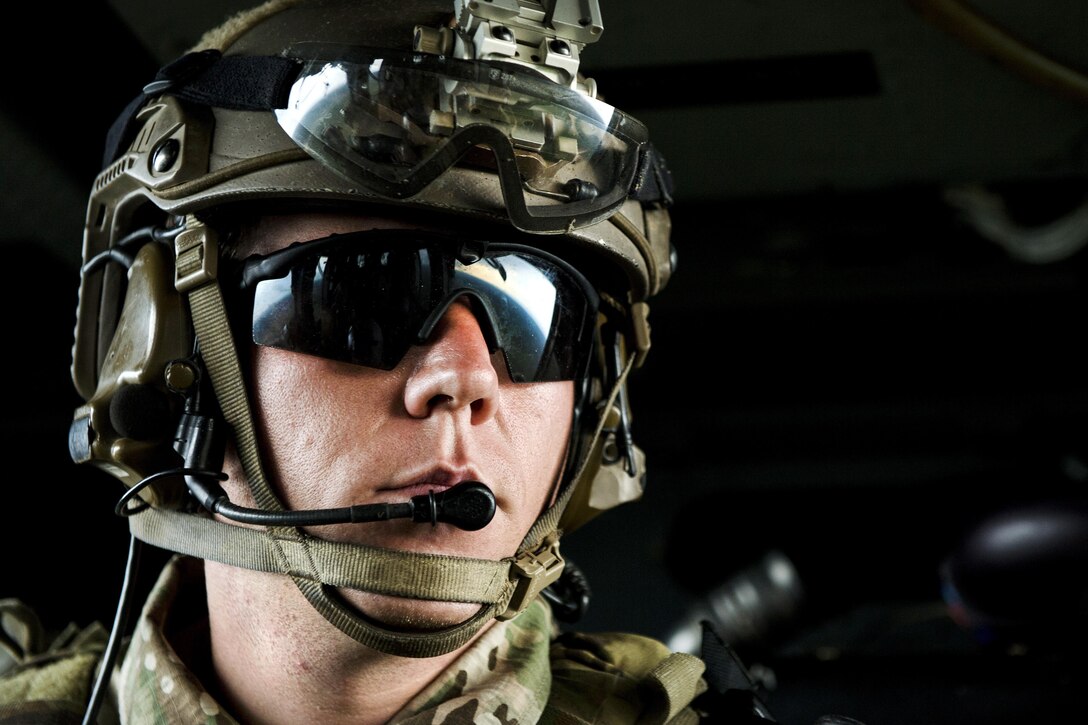 An Army Special Forces soldier travels in a UH-60 Black Hawk helicopter over a training range during Emerald Warrior 16 at Hurlburt Field, Fla., May 3, 2016. Air Force photo by Tech. Sgt. Gregory Brook